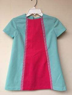 "Although we did use an adult model, this dress was made for a child. Its absolutely adorable and it doesn't matter what age wears it! If it fits it fits! 26.5\" length 31\" across the chest 43\" across the bottom Small what appears to be a pen mark on left corner, see photos" Retro Short Sleeve Dresses With Lace Trim, Cute Fitted Vintage Dress With Short Sleeves, Retro Summer Dresses For Dress-up Occasions, Fitted Short Sleeve Mini Dress For Dress-up, Cute Fitted Pink Vintage Dress, Cute Pink Fitted Vintage Dress, Pink Vintage Mini Dress With Short Sleeves, Vintage Fitted Dress For Dress-up, Fitted Vintage Dress For Dress-up