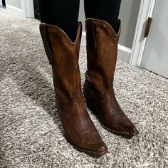 Gorgeous Medium-Dark Brown Leather Ariat Cowgirl Boots! Soft Suede Top Portion, All Leather. Worn Only A Handful Of Times, Designed For A Stylish Weathered Look. They Are A Size 7. I Would Recommend Them For Someone Wearing A 6.5-7. I Usually Wear A 7-7.5 And They Are A Bit Snug On Me! Suede Top, Ariat Boots, Suede Tops, Ariat Shoes, Dark Brown Leather, Cowgirl Boots, Soft Suede, Shoes Heels Boots, Shoes Women Heels