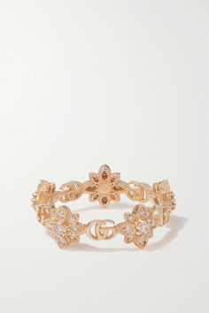 Gucci's 'Flora' ring is cast from 18-karat rose gold to resemble twisting flowers. The delicate blooms alternate with the brand's interlocking 'GG' moniker to form a band around your finger and shimmering diamonds are nestled at the heart of each one. Gucci Designer Rings In 14k Gold, Designer Gucci 14k Gold Rings, Gucci 14k Gold Designer Rings, Gucci Gold Wedding Ring, Gucci Gold Rings For Wedding, Gucci Gold 14k Gold Rings, Luxury Gucci 14k Gold Rings, Gucci 14k Gold Rings For Formal Occasions, Gucci Rose Gold Jewelry Gift