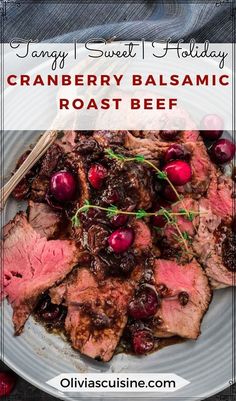 a white plate topped with meat and cranberry balsamic roast beef