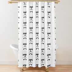 a shower curtain with black and white designs on it