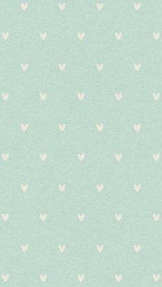 a light green background with white hearts on it