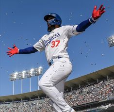 a baseball player is in the middle of throwing confetti