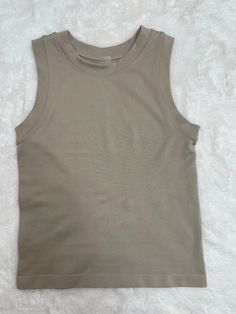 This Basic Tank is the perfect combination of comfort and practicality. Its spandex and nylon blend is soft and supple, creating an ideal fit and lightweight feel. With a round neckline and tank style, you can trust that you'll look and feel great all day long. Feeling Great, Basic Tank, Round Neckline, Spandex