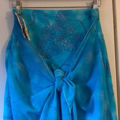 Beautiful Woman’s Pareo. Attached Skirt With Sarong. Can Be Worn Multiple Ways With A Twist Here And Knot There, It Converts To A Sarong, A Halter Top, A Pair Of Shorts Or An Elegant Evening Wrap. (See You Tube For Different Styles). Teal Color With Blue Velvet Flower Swirls. Made Of Poliamida And Elastan. Came In Size 1,2 Or 3. This One Is Size 2 Which Is Medium. Fits Hips Up To 37”. Measures 15” Waist For The Skirt. Skirt Length Is 15”. Sarong Is 37” Long. Light Blue Lined Skirt For The Beach, Fitted Blue Wrap Skirt For Beach, Fitted Blue Wrap Skirt For The Beach, Light Blue Beach Skirt, Blue Wrap Skirt For Summer Beach, Blue Wrap Skirt For Beach And Spring, Blue Wrap Skirt For Spring Beach Outings, Summer Blue Wrap Skirt For Beach, Casual Blue Sarong