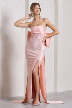 Exude effortless elegance in To You. our statement maxi dress. Saturated in shimmering sequins in a soft pink hue. this enchanting piece features a satin panelled bandeau neckline and boned bodice for extra support. An oversized bow transcends To You. sitting delicately across your back and flowing into captivating elongated train. Perfect for black tie events. try pairing yours with some strappy stilettos and sparkling accents. Features - Premium satin - Sequin embellishments - Bandeau neckline Black Tie Events, Midi Bridesmaid Dress, Pink Icing, Club L London, Black Dress Prom, Black Tie Gala, Strappy Stilettos, Split Maxi Dress, Black Tie Event