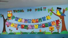 a child's room decorated in bright colors with colorful clothes hanging from the line