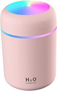 an image of a pink portable speaker with rainbow light on it's side and the word h2o written in blue