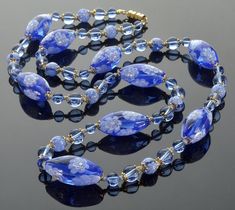 "Vintage Venetian Murano periwinkle blue  glass bead necklace from 1950's The necklace is 30\" long. Hand blown matching canes  translucent glass beads with gilded brass caps, oval  approx. 1\" x 1/2\", round 5/16\". Periwinkle blue beads are 5/16\" and 1/4\". Gilded brass barrel clasp. One oval bead has a small approx. 2mm imperfection from original manufacturing (see last photo). Excellent vintage condition." Necklace Matching, Translucent Glass, Murano Glass Beads, Periwinkle Blue, Glass Bead Necklace, Blue Beads, Murano Glass, Glass Bead, Bead Necklace