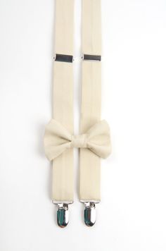 "ITEM DETAILS - 100% cotton fabric - suspenders are fully adjustable - lead-free metal clips with plastic inserts protect clothing from damage - Elastic in the back allows for give when bending over. - bow tie width based on size ordered - Neck strap will fit neck sizes 9\" through 14\" (23-35 cm) and 18\" for adults (longer by request) Colors will view differently dependent upon what kind of device/monitor they are viewed on. We are unable to accept returns due to color matching issues. Free sw Elegant Fitted Belts And Suspenders With Bow, Classic Wedding Belts And Suspenders With Bow Tie, Classic Formal Belts And Suspenders For Summer, Classic Adjustable Belts And Suspenders For Summer, Classic Adjustable Belts And Suspenders With Bow Tie Back, Adjustable Bow Tie Back Belt For Wedding, Adjustable Wedding Belt With Bow Tie Back, Adjustable Classic Belts And Suspenders For Groom, Champagne Bow Tie