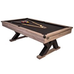 a pool table with two cues and one ball resting on the top, in front of a white background