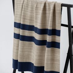 a chair with a blanket draped over it