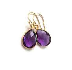 "Faceted Amethyst teardrops are incased in a Vermeil bezel. Beautiful color!! The Amethyst teardrops are Hydro quartz The Gold Filled earring wires are made in the USA. The total earring measures 1 1/4\". Lever backs are available for a $3 upgrade. To see all my other Amethyst items click here: https://www.etsy.com/shop/PhaedoraJDesigns?ref=seller-platform-mcnav&search_query=Amethyst" Earring Wires, Birthstone Earrings, Amethyst Gold, Birthstone Gifts, Gold Filled Earrings, February Birthstone, Birthstone Earring, Amethyst Earrings, February Birth Stone