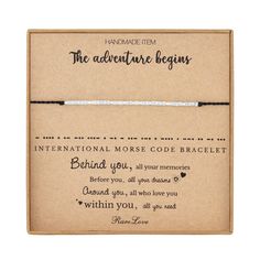 the adventure begins bracelet is packaged in a cardboard box and has a message on it