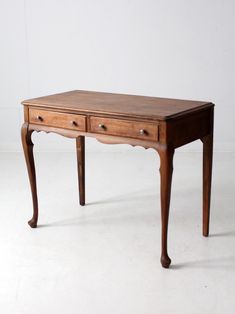 This antique writing desk, crafted by Rockford Cabinet Company, is a classic French Provincial style piece. The console table features two functional drawers and graceful curved legs. Circa 1910 CONDITION In good condition with wear consistent with age and use.  A small, recessed step on the back edge of the tabletop, perhaps intended to accommodate a mirror. MEASUREMENTS Height: 30" ..  76.2 cm Width: 38" ..  96.5 cm Depth: 20" ..  50.8 cm Apron Height: 23.5" ..  59.7 cm SHIPPING Home delivery via a blanket wrap service.  Delivery estimate in 4-6 weeks.  Faster shipping available. Please contact us for expedited options and pricing.   A contact phone number is required for shipment. Please provide at checkout.  International and non-contiguous US customers, please contact us for shipping Antique Writing Desk In Bedroom, Craftsman Desk, Antique Desk Office, Queen Anne Desk, Vintage Wood Desk, French Provincial Living Room, French Vanity, Victorian Desk, Vintage Writing Desk