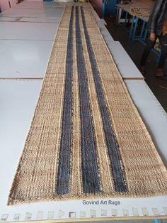 the rugs are laid out and ready to be woven into the tableclothes