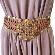 Vintage wide waist braided women's belt. Made of genuine leather in milk brown and metal details. 5 holes, hook fastening Size S Dimensions - 33.8''/86cm long end to end 29''/74cm long to the first hole 33''/84cm long to the last hole 4''/10cm wide /max/ Very good condition. Leather Corset Belt For Festivals, Adjustable Brown Belt For Festival, Adjustable Brown Belts For Festival, Brown Leather Rope Belt, Bohemian Brown Rope Belt, Adjustable Brown Corset Belt With Matching Belt, Adjustable Corset Belt With Belt Loops For Festivals, Adjustable Corset Belt For Festivals, Brown Leather Corset Belt With Removable Belt