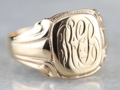 This antique signet ring features beautiful deep carved scrolling motifs in the shoulders and a nice sized face with the original monogram. Particularly nice is the fine milgrain worked into the carved motifs. Please note that this signet ring has its original monogram. Unfortunately, this piece cannot be altered without affecting the quality of the piece. Please feel free to contact us to help you find your perfect signet ring in your style and budget! Metal: 14K Yellow Gold Top Measurements: 1 Signet Rings Women Vintage, Mens Gold Signet Rings, Yellow Gold Sapphire Ring, Signet Rings Women, Gold Initial Ring, Signet Ring Men, Top Measurements, Monogram Ring, Signet Rings