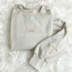 Jesus is King Sweatshirt | Sand Embroidered Sweatshirt | Christian Apparel | Faith based Apparel Embroidered Cream Long Sleeve Sweatshirt, Cream Embroidered Long Sleeve Sweatshirt, Cream Long Sleeve Sweatshirt With Embroidered Text, Relaxed Fit Embroidered Cream Sweatshirt, Cream Embroidered Relaxed Fit Sweatshirt, Jesus Apparel, Christian Embroidery, Jesus Clothes, Christian Shirts Designs