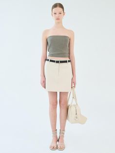 This is a mini skirt made of cotton blend material. This skirt has basic details and a minimalist design, making it easy to coordinate with a variety of tops.- Pockets on both sides for practical use- Can be styled with a belt- Available in 3 colors: Ivory, Beige, Black Fitted Cotton Skirt With Belt, Cotton Fitted Belted Mini Skirt, Belted Fitted Cotton Mini Skirt, Fitted Cotton Belted Mini Skirt, Belted Cotton Mini Skirt, Fitted Belted Beige Mini Skirt, Fitted Beige Belted Mini Skirt, Minimalist Design, Simple Designs