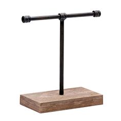 a wooden stand with two metal bars on it's sides and one black rod