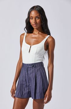 U-bar sleeveless bodysuit Snap closure Partially lined (bust only) Self: 75% Nylon, 25% Elastane / Lining: 95% Polyester, 5% Elastane Hand wash cold, do not bleach Line dry, iron low if needed Do not tumble dry Style #AT18444 White Fitted Tank Top With Lined Body, Chic Lined Tank Top For Night Out, Elegant Summer Tank Top With Lined Body, Elegant Lined Summer Tank Top, Fitted Bodysuit With Tank Straps For Party, Chic Sleeveless Bodysuit With Lined Body, Spring Bodysuit With Tank Straps And Lined Body, Chic Sleeveless Lined Bodysuit, Chic Fitted High Waist Tank Top