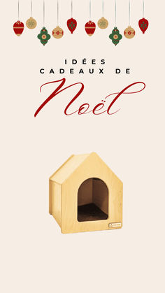 a dog house with ornaments hanging from it's ceiling and the words noel written in french