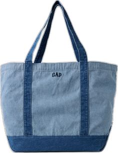 a large denim bag with the word gap on it's front and side pockets