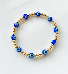 I love these mini blue evil eye beads! Paired with 4mm 14K gold filled or sterling silver beads. Perfect to stack or wear alone! I love jewelry that is personal and tells a story. Let me know how I can personalize pieces for you! - need a special size you don't see? Message me and I will be happy to do my best to accommodate :) Care for your LeLu jewelry- ALWAYS roll bracelets onto your wrist! Try to avoid stretching them as much as possible. This will help them last longer. I never take mine of Blue Spiritual Stackable Jewelry, Everyday Blue Jewelry With 8mm Beads, Blue 14k Gold Everyday Bracelets, Dainty Blue Round Evil Eye Bracelet, Everyday Blue 14k Gold Bracelets, Everyday Evil Eye Beaded Bracelets, Blue Beaded 14k Gold-filled Jewelry, Dainty Blue Stackable Bracelets, Everyday Blue Evil Eye Jewelry