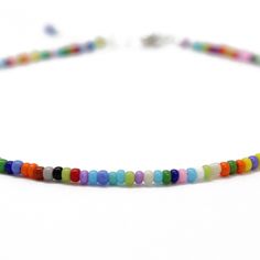 "A tiny rainbow bead anklet. This is such a cute multi color seed bead anklet! The colors include, purple, orange, red, white, green, sky blue, yellow and pink, just to name a few! The beads are made from glass. I hand string these seed beads on beading wire and finish them with a sterling silver lobster clasp and small length of sterling silver chain. This anklet has a 1\" sterling silver chain extension. The length on the listing is the total length measured end to end including the extension. Multicolor Round Beads Anklets As Gift, Multicolor Round Beads Anklets For Gift, Casual Multicolor Round Beads Anklets, Casual Multicolor Tiny Beads Anklets, Gift Multicolor Round Bead Anklets, Gift Multicolor Round Beads Anklets, Casual Multicolor Beaded Anklets, Casual Multicolor Anklets With Tiny Beads, Seed Bead Anklet