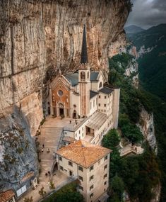 an old church built into the side of a cliff