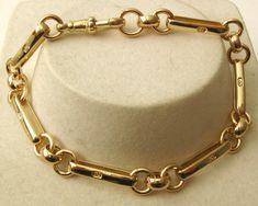 100% AUSTRALIAN MADE BRAND NEW GENUINE HIGH QUALITY SOLID 9ct YELLOW GOLD ALBERT BRACELET secured with CLASP All LONG BAR LINKS are HALLMARKED 375 for Authenticity  GENUINE SOLID GOLD    NOT FILLED    NOT PLATED    NOT HOLLOW    Bracelet length : 19.5 cm (7.8 Inches approx. with swivel clasp) Bracelet width : 7 mm Bracelet weight : 13.60 grams approx. Clasp size : 21 mm x 8 mm  Our QUALITY is GUARANTEED. Buy with confidence. If you are not satisfied for any reason you can return it for a full re Clasp Bracelet, Mens Gold, Bracelet Clasps, Chain Link Bracelet, Link Bracelets, Chain Link, Charm Pendant, Solid Gold, Gold Jewelry