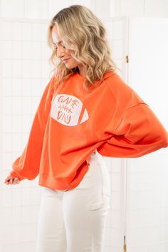 Stand out in the crowd and show off your team spirit with the Gameday Orange Sequin Football Long Sleeve Crew! This orange long sleeve crew neck is just the right weight for fall, featuring a dazzling sequin football on the front that adds a playful touch to your game day look. With an oversized fit and ultra-soft fabric, you'll stay comfortable while cheering on your team in style. Features: Vibrant orange color and long sleeves make it perfect for fall game days. Eye-catching sequin football d Jumper Denim, Orange Long Sleeve, Game Day Outfit, Baseball Outfit, Graphic Tee Dress, Football Design, Gameday Outfit, Day Outfit, Maxi Dresses Casual