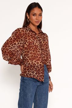 DETAILS    Feel sophisticated and stylish in this beautiful collard v neckline top! Featuring long sleeves with button close, functional buttons down the front and a stunning floral print, this top will have you looking your best.   collard v neckline  long sleeves with button close  functional buttons down front  leopard print  relaxed fit  unlined  m aterial - 100% polyester     SIZING     studio model is 5' 8" and wears a Size XS    model stats: bust - 31", waist - 24", hips - 35"          GA V Neckline Top, V Neckline, Button Downs, Leopard Print, Floral Print, Floral Prints, Relaxed Fit, Long Sleeve, Floral