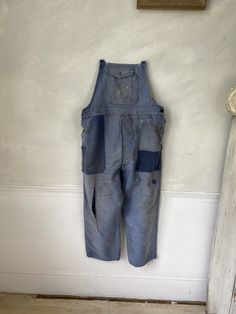 Hello and welcome to the Textile Trunk! Please follow us on Instagram, we are @textiletrunk As hipster as they get! Rustic, primitive wear ~ This textile is a lovely pair of vintage French overalls!! The top straps are all missing, but these are still a lovely treat! Made from a beautiful heavy weight indigo denim moleskin! ~~ These overalls date to the 1940s or a bit earlier~ There are two front pockets at the waist, and a button pocket on the bib. ~ lovely for creative hands to add some straps Vintage Denim Jeans With Side Pockets, Vintage Denim Bottoms With Side Pockets, Vintage Cotton Jeans With Side Pockets, Retro Blue Jeans With Pockets, Indigo Cotton Overalls With Pockets, Vintage Washed Cotton Overalls, Vintage Denim Blue Overalls, Vintage Cotton Jeans With Pockets, Vintage Dark Wash Bottoms With Patch Pockets