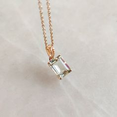 This stunning pendant is set in 14K Solid Yellow Gold with Natural Green Aquamarine with utmost precision. It is an unique gemstone pendant for nearly every occasion and is completely hassle-free jewelry. ITEM DETAILS * Gem: Aquamarine * Gem Size: 6X8mm * Gem Shape: Octagon * Gem Weight: 1.39 carats * Gold Purity: 14KT  * Gold Weight: 0.42 gram * Total Weight of the Pendant: 0.70 gram The Gold purity is guaranteed and it comes with authentic 14KT gold hallmark. Since my items are handmade, they are absolutely nickel and lead free. CUSTOMIZATION * Gemstone customization is available and it can be substituted with a gem of your choice. Kindly message me for the same. PACKAGING * The Pendant comes with layers of safe and secure wrapping along with Free handmade jewelry box with every purchase 14k Gold Necklace With Bail For Gift, Emerald Cut Green Amethyst Yellow Gold Jewelry, Fine Jewelry Green Amethyst Gemstones For Gifts, Green Amethyst Pendant Necklace As Gift, Classic Green Amethyst Jewelry For Gift, Fine Jewelry Green Amethyst Gift, Fine Jewelry Gift With Green Amethyst, Green Amethyst Jewelry For May Birthstone Gift, Pisces And Aquarius