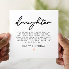 someone holding up a birthday card that says, daughter it has been the most special occasion