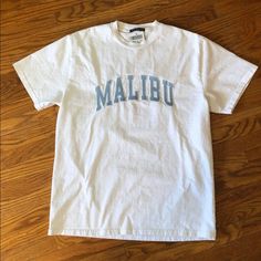 Brandy Melville Oversized White Tee With Malibu Embroidered On It In Blue. Super Rare And Not Sold Online. Brand New With Tags. Open To Offers! One Size But Can Fit Xs-Xl Depending On Desired Fit- I’m An Xs/S And It Fit A Little Oversized But It Wasn’t Huge Brandy Melville Oversized Shirt, Brandy Melville Wishlist, White Embroidered Logo Top For College, Blue Casual Top With Embroidered Logo, Casual Blue Top With Embroidered Logo, Casual Blue Tops With Embroidered Logo, Blue Top With Embroidered Text For Streetwear, Blue Tops With Embroidered Text For Streetwear, Blue Embroidered Text Streetwear Tops