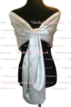 the back of a dress with a white bow on it