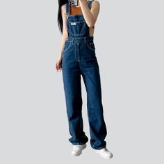 Step into the '90s with our dark wash distressed denim jumpsuit from the 2023 Spring-Summer Collection ââ‚?a modern take on aged style!Why It's Your Next Summer StapleThis ageless denim jumpsuit is the perfect blend of established fashion and edgy. aged style. With its straight leg silhouette and mid wash. this jumpsuit is patterned to flatter any figure while giving off that effortless cool. grunge look. The distressed pattern adds a unique touch. and the zipper and button closure ensure both t Dark Wash High Rise Jumpsuits And Rompers With Pockets, High Rise Dark Wash Jumpsuits With Pockets, High Rise Dark Wash Jumpsuits And Rompers With Pockets, High Waist Denim Jumpsuit For Streetwear, Trendy High Rise Washed Denim Jumpsuit, Trendy High-rise Washed Denim Jumpsuit, Trendy High Rise Medium Wash Overalls, Trendy High Rise Overalls In Medium Wash, Trendy High Rise Denim Overalls