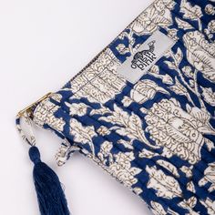 Introducing our exclusive Quilted Pouch, the perfect accessory for keeping your small treasures in order. This hand block printed pouch is not only stylish but also highly versatile. Made from 100% organic cotton, it features a top zip closure to ensure everything stays securely in place. Whether you need it for cosmetics, medicines, school or office supplies, this quilted pouch is designed to keep you organized on the go. . Top zip closure. 100% organic cotton. Quilted. Dimensions: 15.5 x 19 (C Blue Cotton Bag With Zipper Pouch, Blue Cotton Bags With Zipper Pouch, Quilted Pouch, Makeup Pouches, Everything Stays, Bag Design, Makeup Pouch, Modern Prints, Cotton Top