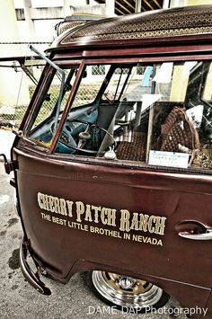 an old car with many items in the back and side window that says cherry patch ranch, the best little brother in nevada