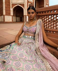 This exquisite bandhani banarasi lehenga features a stunning jamavar panel, showcasing traditional craftsmanship. The embroidered blouse is detailed with cutwork on the neckline and hem, adding an elegant touch. Paired with a sheer dupatta adorned with floral butis and delicate gota, this ensemble radiates charm. The waist belt, embellished with mirrors, completes the look with a hint of sparkle, perfect for any festive occasion. Sheer Dupatta, Silk Lehenga, Organza Dupatta, Powder Pink, Cut Work, Embroidered Blouse, Indian Dresses, Waist Belt, Silk Blouse