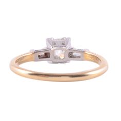 Antique American Lambert Bros Art Deco engagement ring, circa 1920. This 14 karat gold ring features a .87 carat old European cut center diamond with VS1 clarity and G color. The center is flanked by a .05 carat baguette cut diamond on each side. These diamonds have VS1 clarity and G-H color. This Art Deco ring is from Lambert Bros of New York and is a size 8.75. Item ID:EROS D823 Classic Baguette Cut Single Diamond Ring, Vintage Princess Cut Solitaire Ring, Classic Single Diamond Jewelry For Marriage, Antique Asscher Cut Wedding Rings, Heirloom Solitaire Baguette Cut Diamond Ring, Art Deco Yellow Gold Ring With Single Diamond, Heirloom Solitaire Diamond Ring With Baguette Cut, Antique Yellow Gold Emerald Cut Diamond Ring, Antique Wedding Diamond Ring With Single Diamond