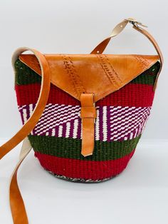 African Kenyan Handmade Traditional sisal tote kiondo handbag. Casual Beach bag Made from sisal Wool and leather handles. The bags are durable And unique. 100% made in Kenya. Measuring about  25cm wide x 19 cm H. The tote bag is lined inside with black lining. Traditional Baskets, Basket Tote, Natural Sisal, Wear Necklaces, Natural Stones Necklace, Beaded Hoop Earrings, Beaded Hoops, Tote Handbag, Small Handbags