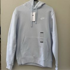 Look Stylish And Comfortable In This Nike Men's Sportswear Club Pullover Hoodie In Size S. The Pullover Features A Drawstring Closure And Is Made Of A Soft Cotton Blend Fleece Fabric, Making It Perfect For Winter, Summer, And Spring. It Also Has A Hooded Design With An Embroidered Nike Logo On The Front, Adding A Touch Of Modern Style To Your Sports Wardrobe. This Hoodie Is Machine Washable And Comes In A Light Blue Color With A Yellow Nike Logo Pattern. It's Perfect For Football Enthusiasts And Embroidered Nike, Yellow Nikes, Men's Sportswear, Stylish Hoodies, Mens Hoodie, Sports Style, Nike Sweater, Fabric Making, Sports Clubs