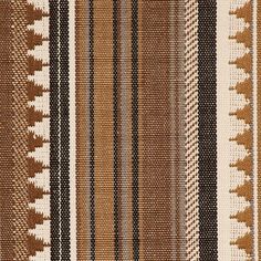 a brown and white striped rug with many different patterns on it's sides,