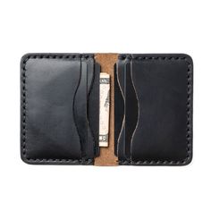 A Leather Wallet that goes Above and Beyond Your Expectations.When you hold this wallet you will love the supple and comfortable feel. Unlike most department store wallets, our leather features premium leather, thick hand-stitching, and polished edges. Every inch of our craftsmanship has a high level of attention to detail. We build wallets to last a lifetime - and guarantee it.Our full-grain leather means your wallet will develop character and patina. We hand-sew this wallet with thick Tiger Th Classic Bifold Wallet For Personal Use, Black Bifold Wallet With Interior Card Slots, Black Trifold Wallet With Coin Pocket For Everyday, Black Bifold Wallet For Daily Use, Black Bifold Card Holder For Everyday Use, Black Wallets With Card Slots For Daily Use, Classic Black Wallet For Everyday Use, Classic Bifold Coin Purse For Everyday, Classic Black Wallets For Everyday