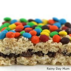 a close up of a candy bar with cereal and m & m on it's side