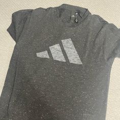 Grey Speckled T-Shirt Never Worn Casual Pre-shrunk T-shirt For Workout, Trendy Adidas T-shirt With Letter Print, Casual Adidas Logo Top For Workout, Casual Workout Top With Adidas Logo, Casual Adidas Workout Top, Adidas Logo Athleisure Crew Neck Tops, Gray Pre-shrunk Tops For Workout, Basic Adidas Logo Crew Neck Tops, Basic Adidas Crew Neck Tops